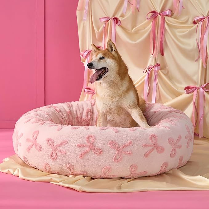 LE SURE Donut Small Dog Bed - Round Cat Beds for Indoor Cats, Washable Calming Pet Beds with Teddy Sherpa Plush & Anti Slip Bottom (Bow Pink Taffy, S Plus (27x27x8))